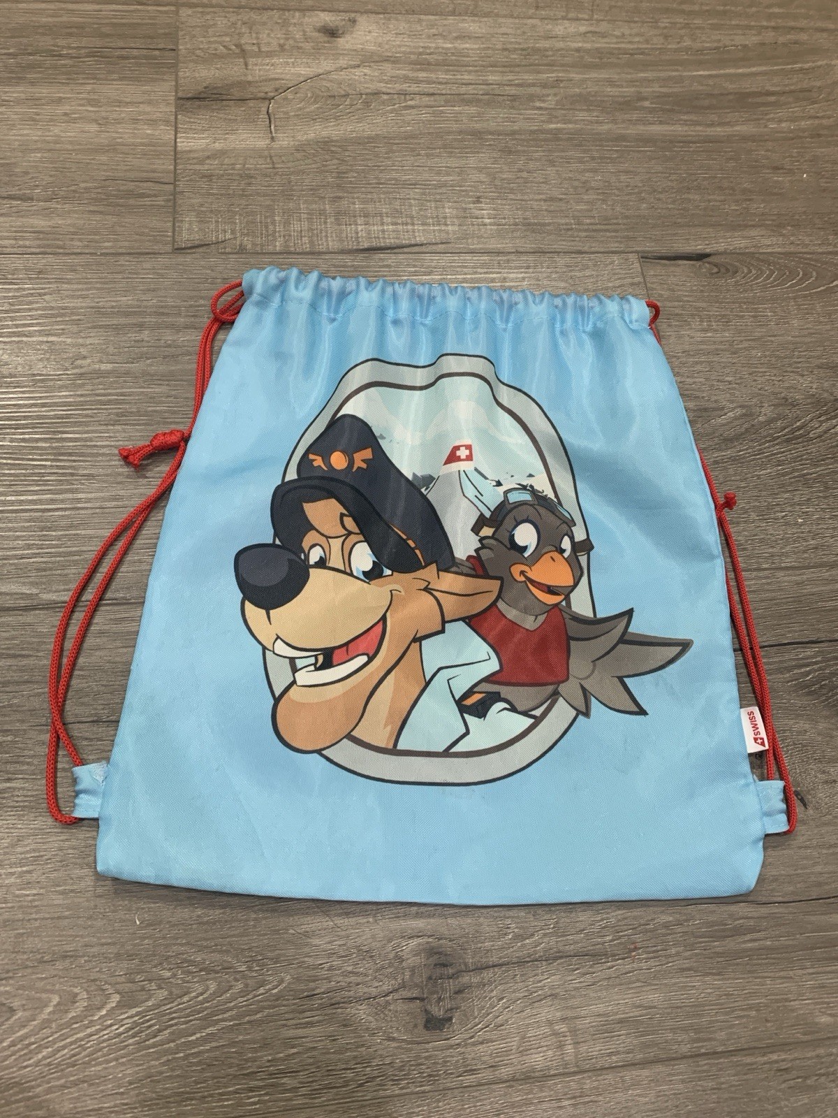 Swiss Air Line String Bag Blue With Alps, Dog Captain And Pilot Bird Graphic