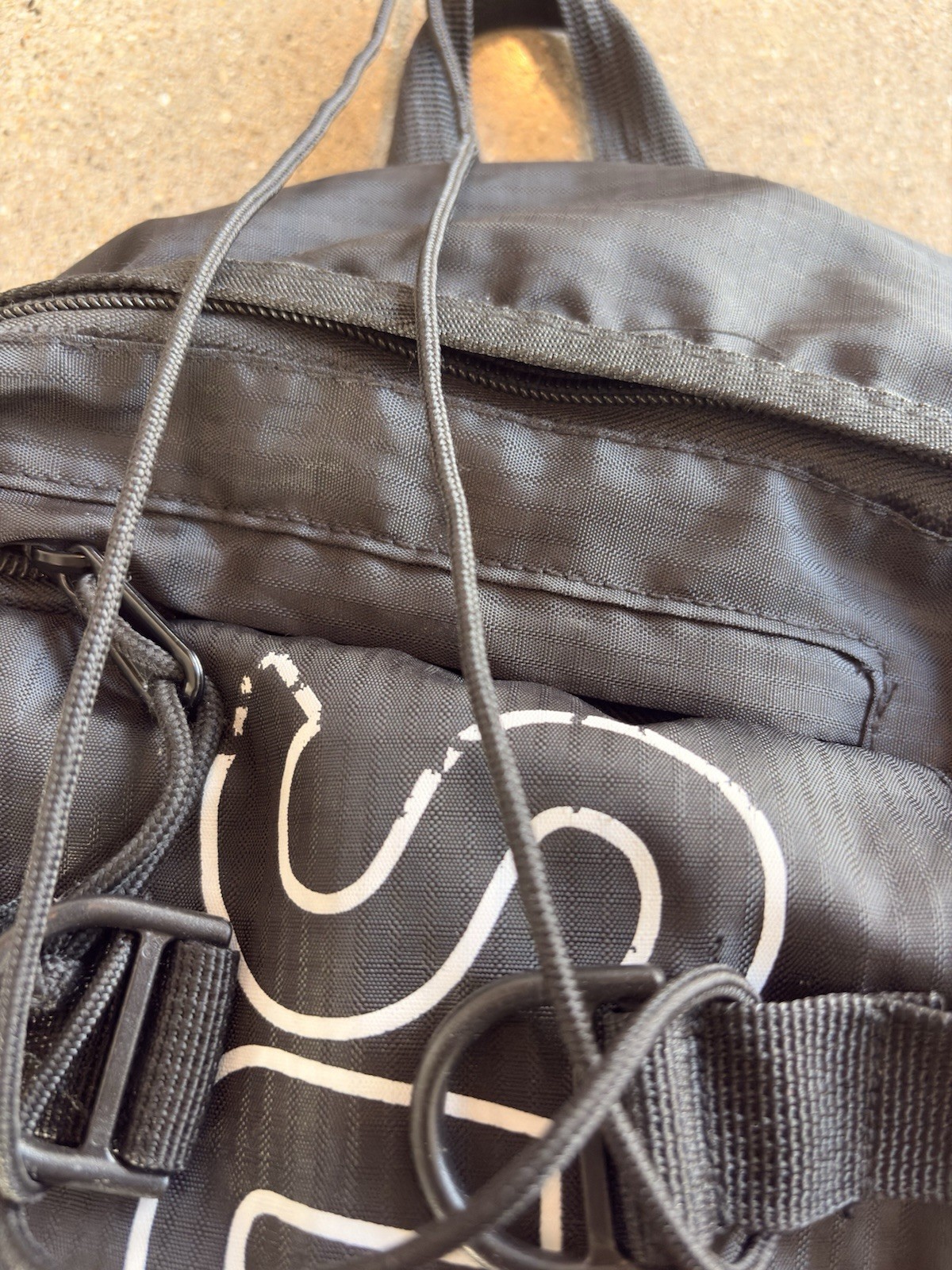 Supreme SS18 Reflective Backpack Black Spellout