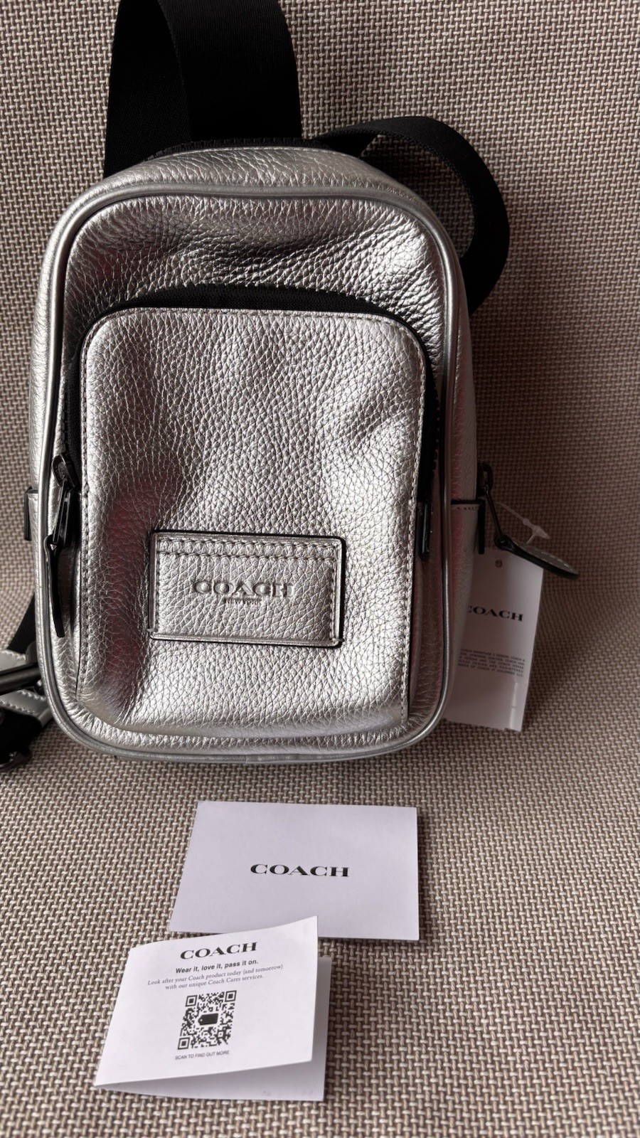 Coach Track Pack 14 in Metallic Ash.