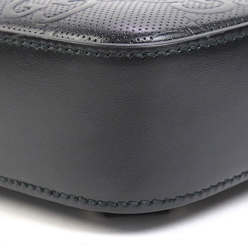 Gucci GG Embossed Sling Backpack Black Perforated Leather Crossbody Shoulder Bag