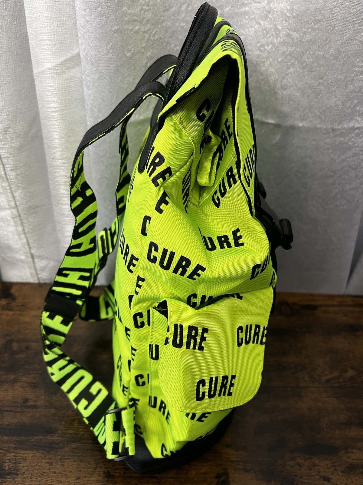 Green/Black CURE Logo Print Backpack Drawstring Buckle Adjustable Straps
