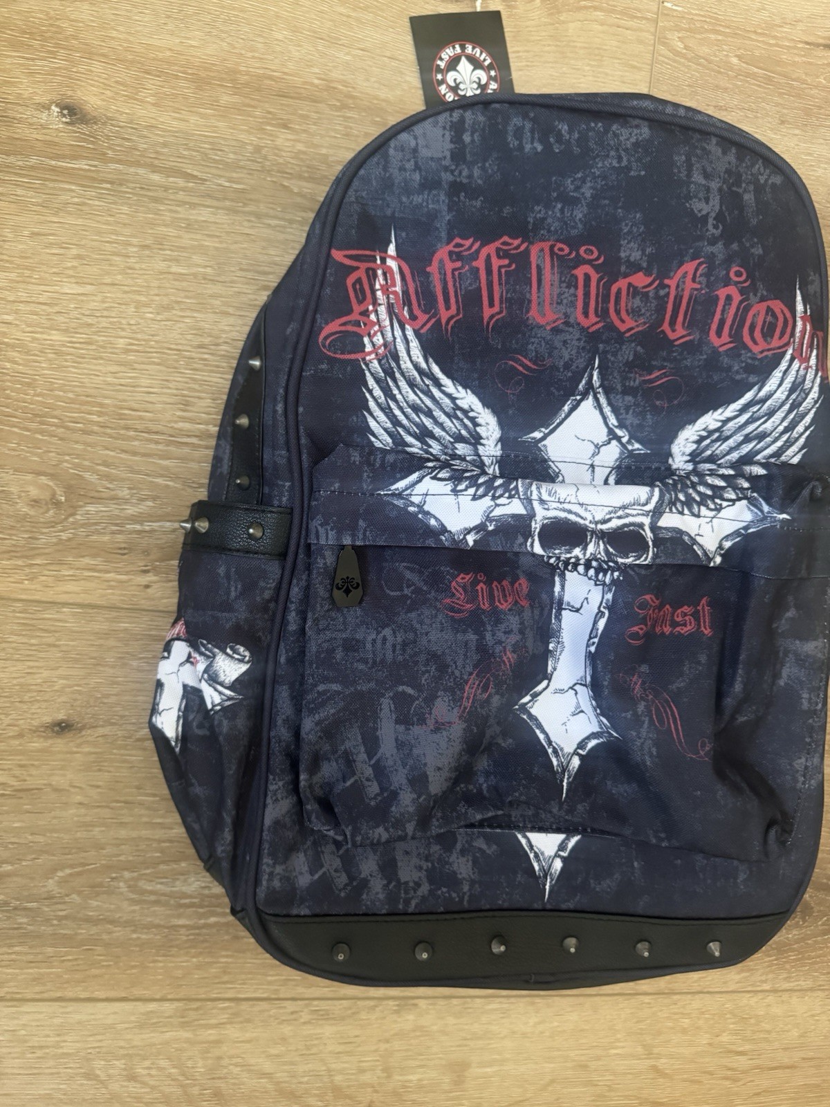 RARE Affliction black & navy backpack with white & red skull with wings graphic
