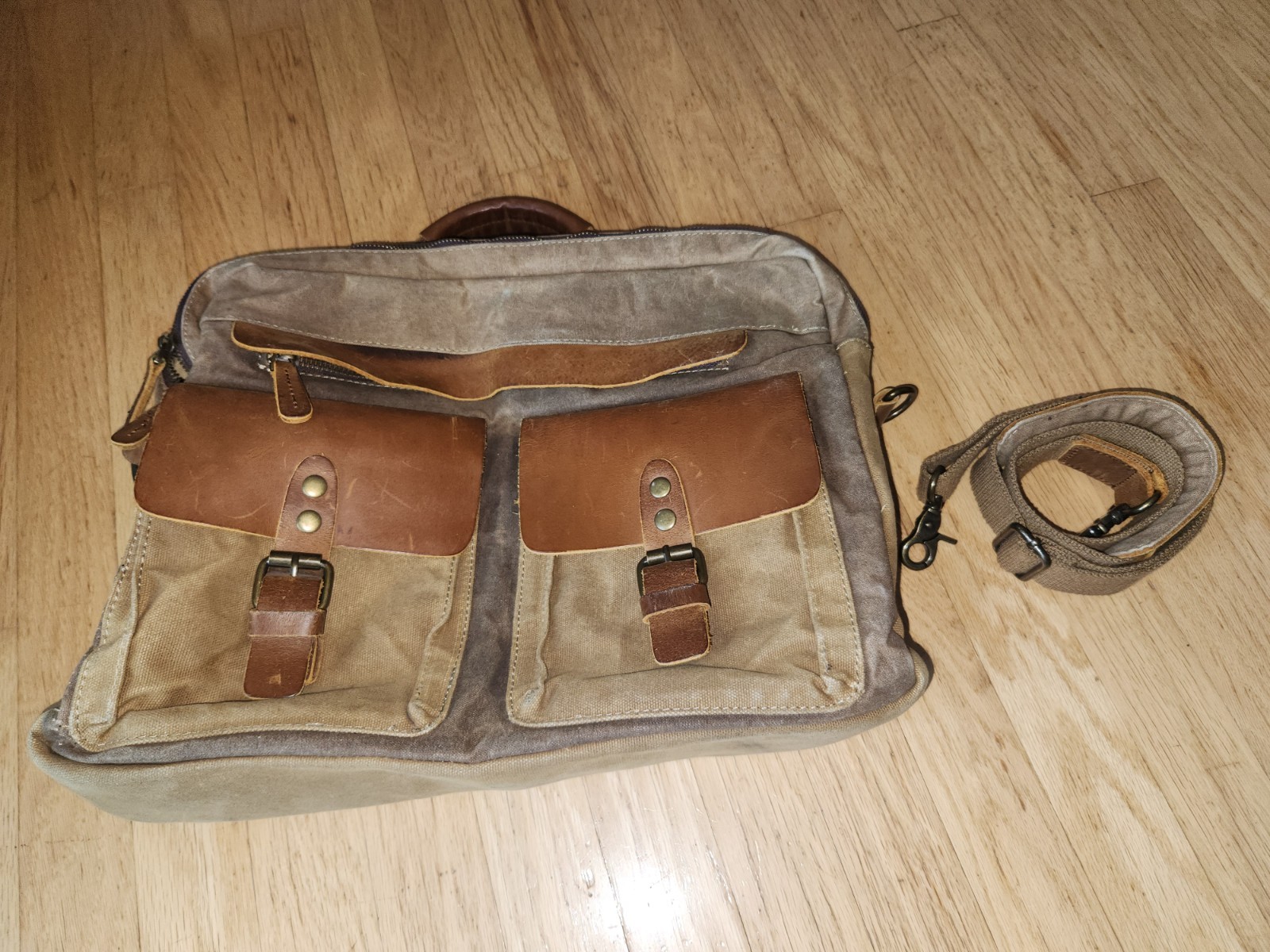 Newhey brn waxed cotton, leather trim & buckle look outer pockets messenger bag