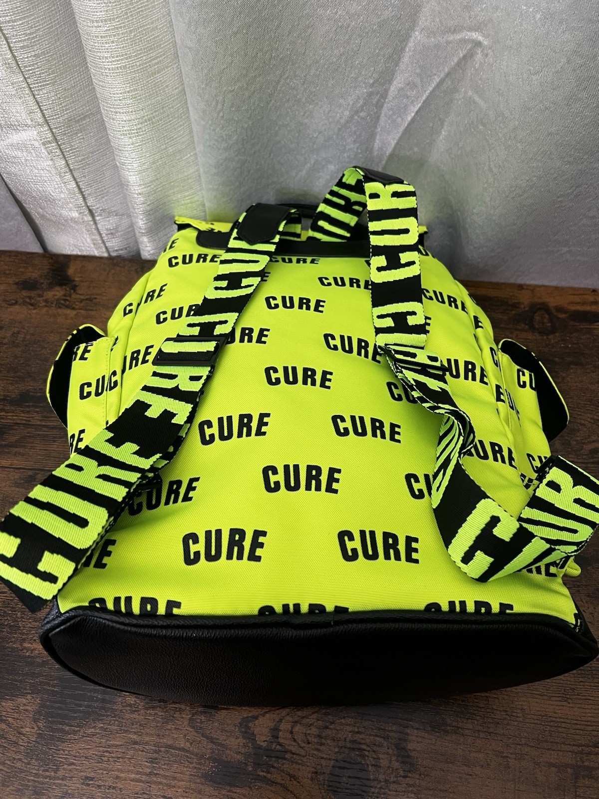 Green/Black CURE Logo Print Backpack Drawstring Buckle Adjustable Straps