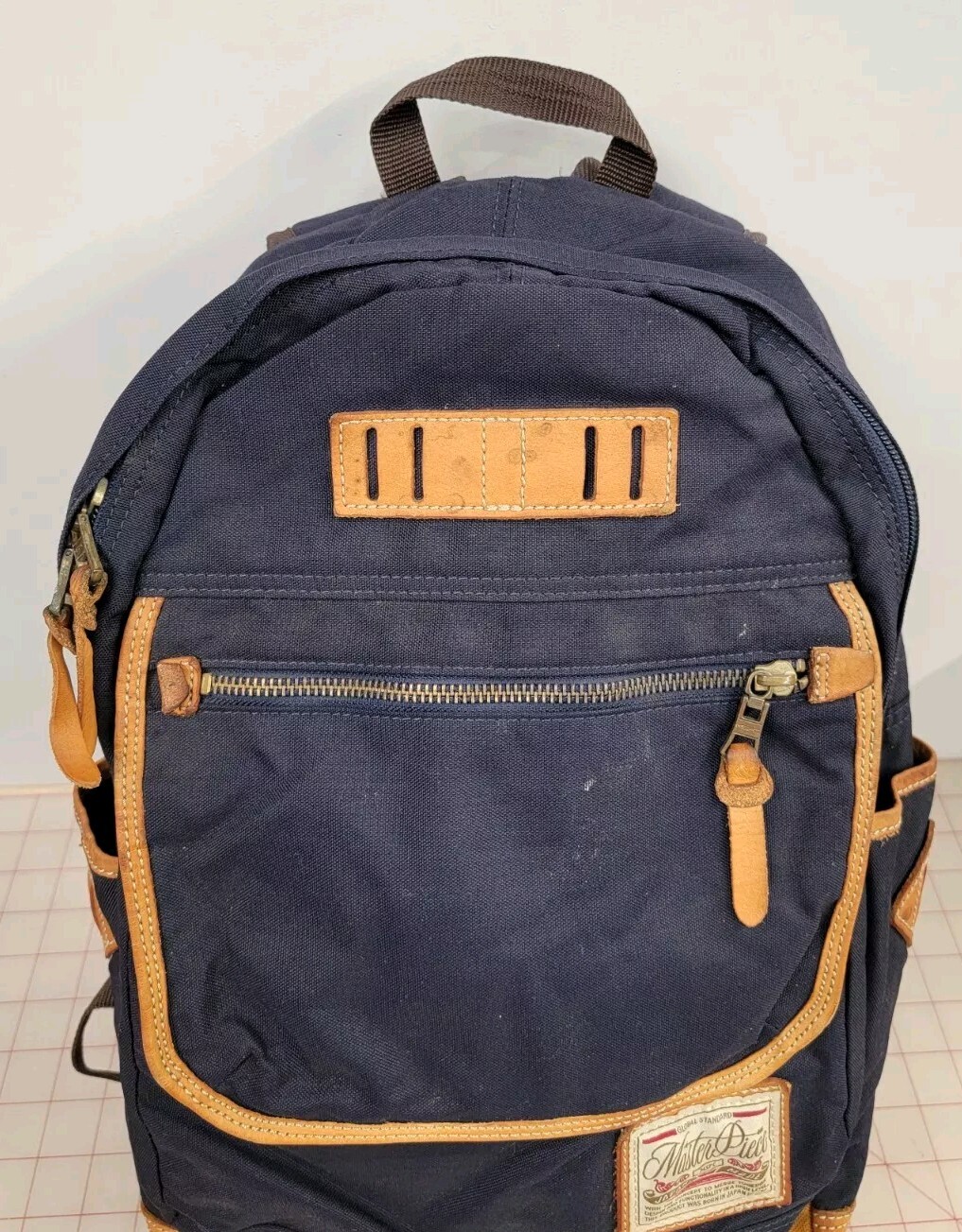 Master-Piece Backpack – Made in Japan Navy & Tan Leather.