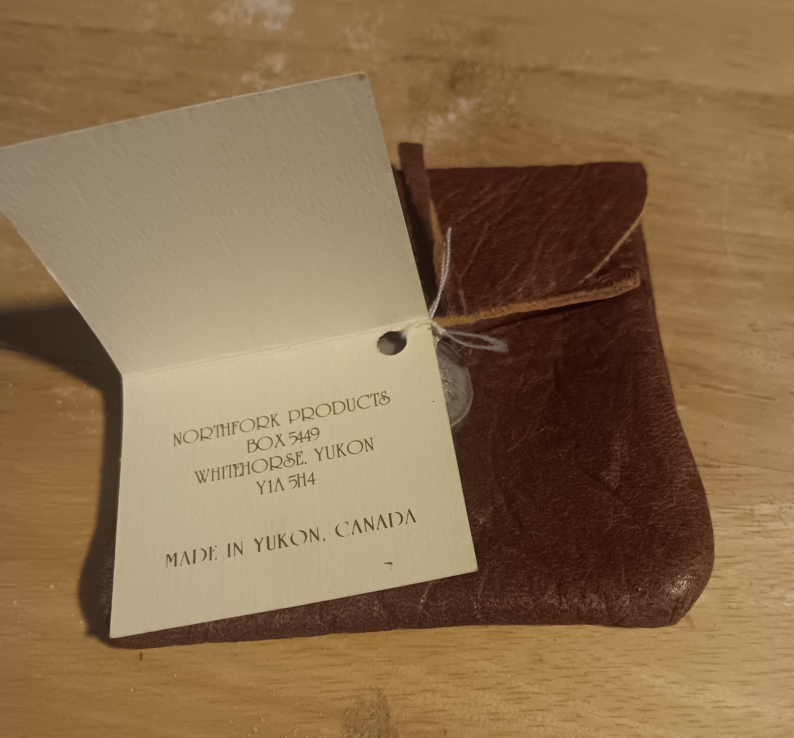 handcrafted leather pouch from the Yukon, secured with bone button 3.5″x3.5″