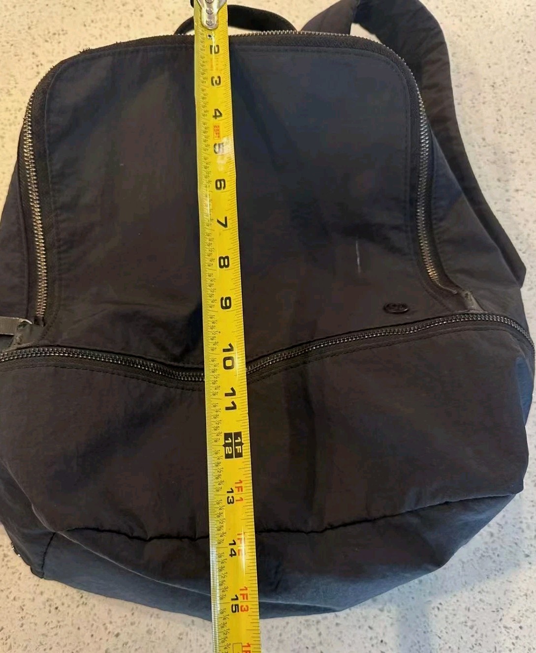 Black Lululemon City Adventurer backpack,iconic metal logo and waterproof fabric