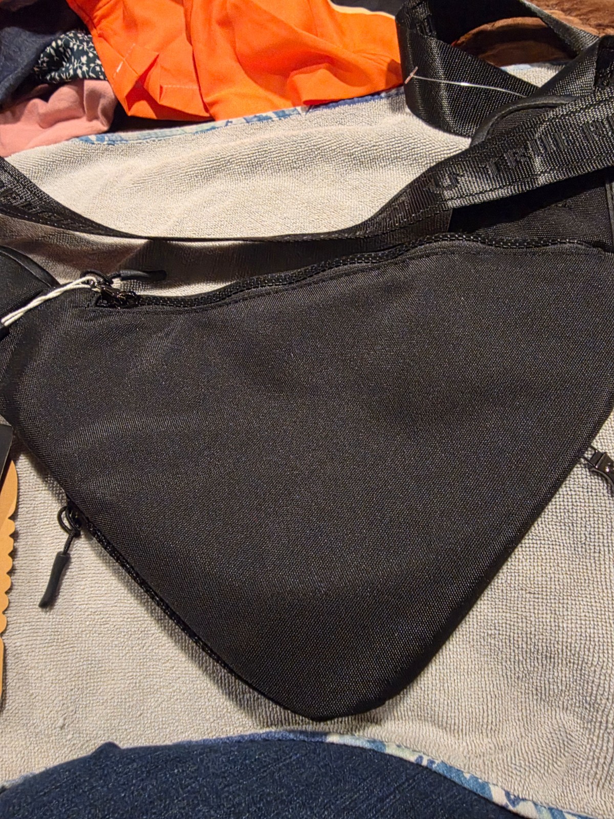 True Religion black Triangular Sling crossbody bag unisex. NWT