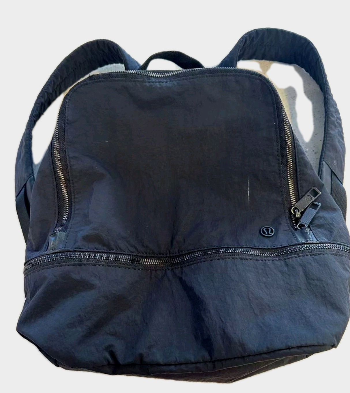 Black Lululemon City Adventurer backpack,iconic metal logo and waterproof fabric