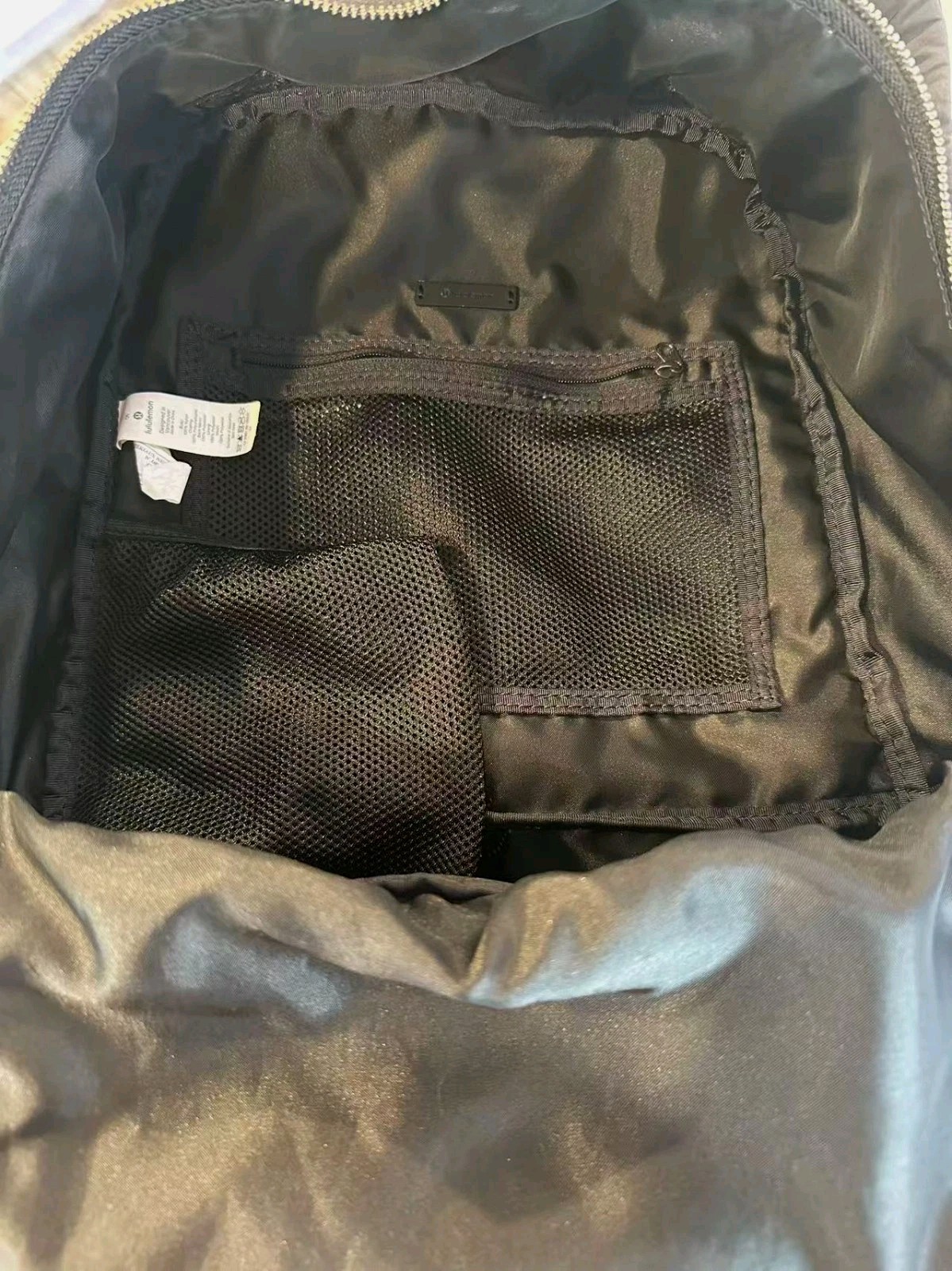 Black Lululemon City Adventurer backpack,iconic metal logo and waterproof fabric