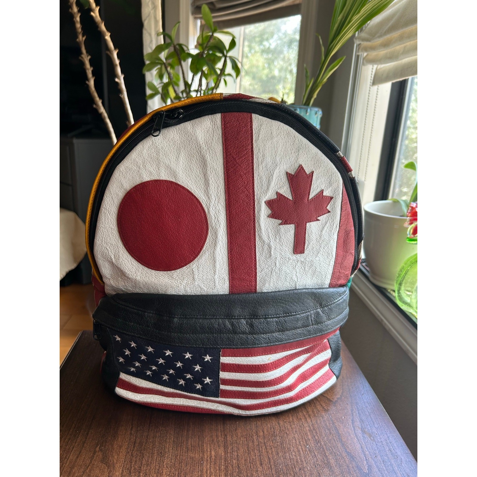 Vintage Wilsons Leather Multi-National backpack leather flag USA Japan Canada