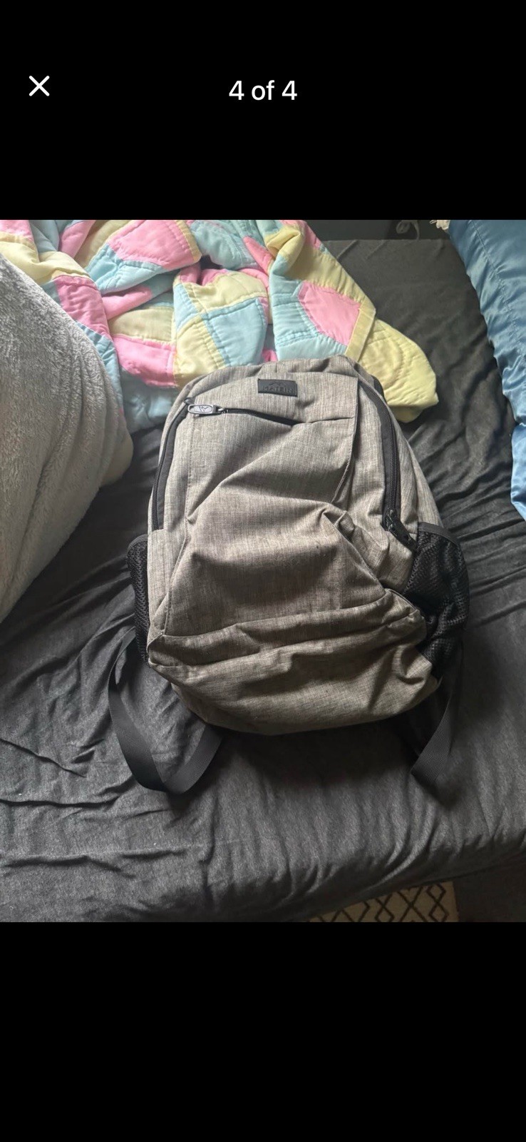 Grey backpack 6 inches deep 12 inches wide and 15 inches tall