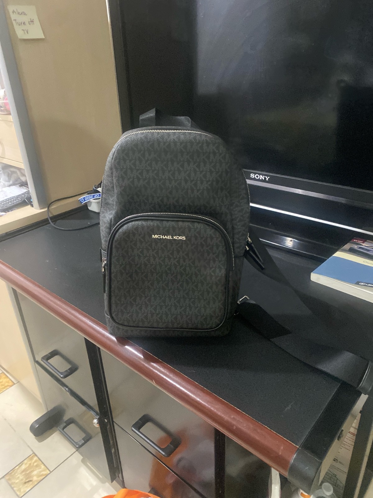 1 black Michael Kors cooper Logo Sling Pack in mint condition brand new