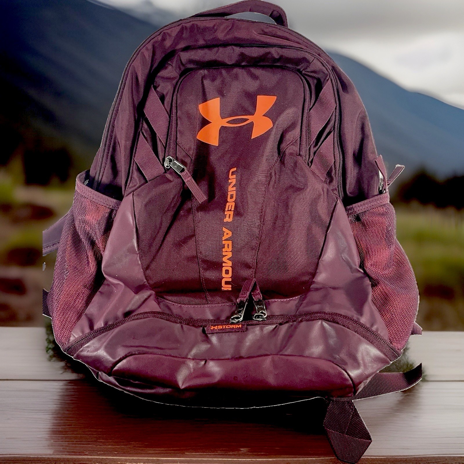 Under Armour Hustle 3.0 Backpack in the Dark Maroon and Orange colorway.