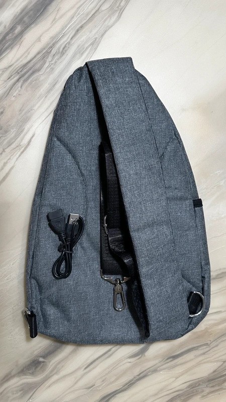 Versatile Zippered Sling Bag with USB and Cord