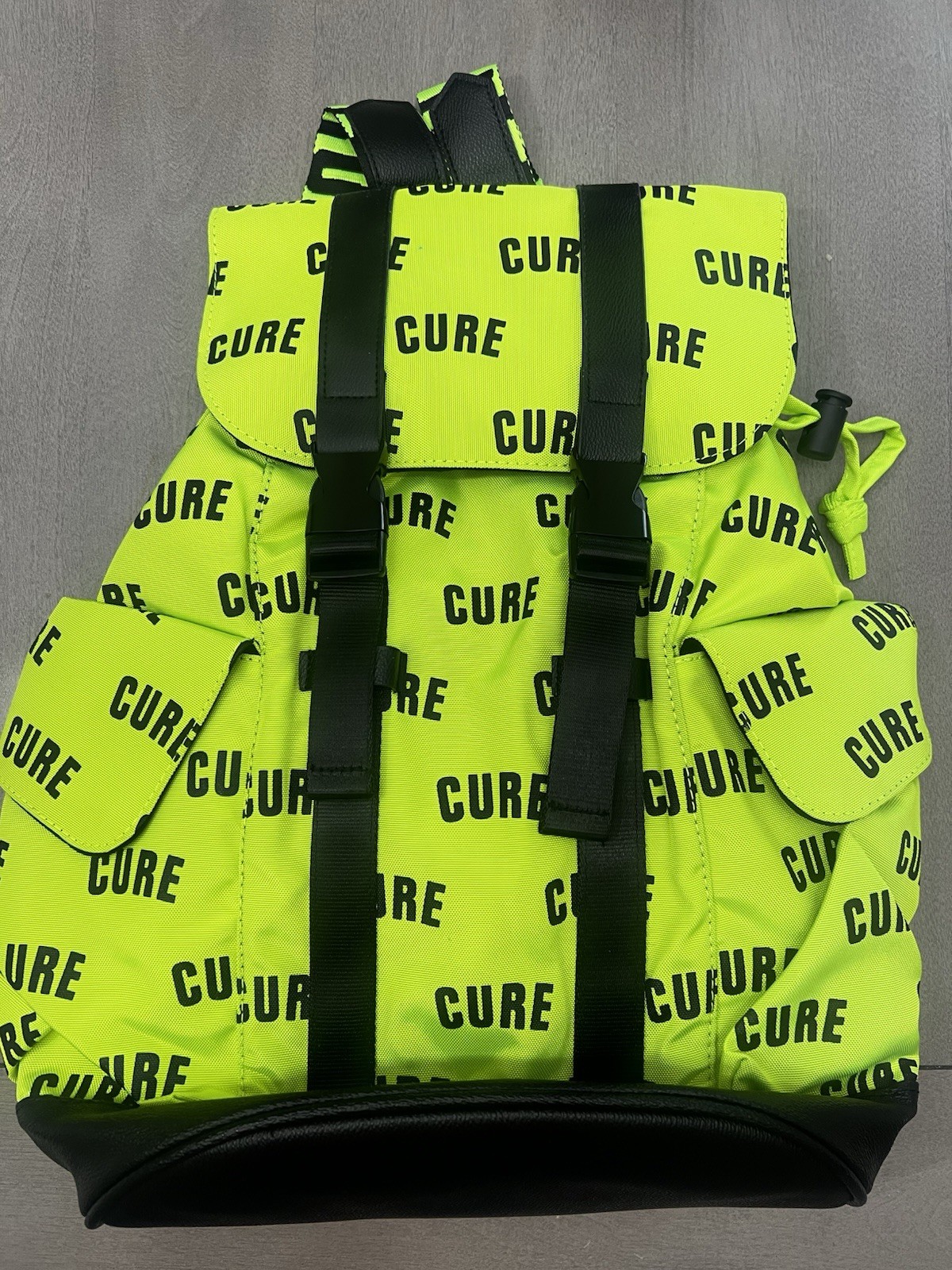 Green/Black CURE Logo Print Backpack Drawstring Buckle Adjustable Straps