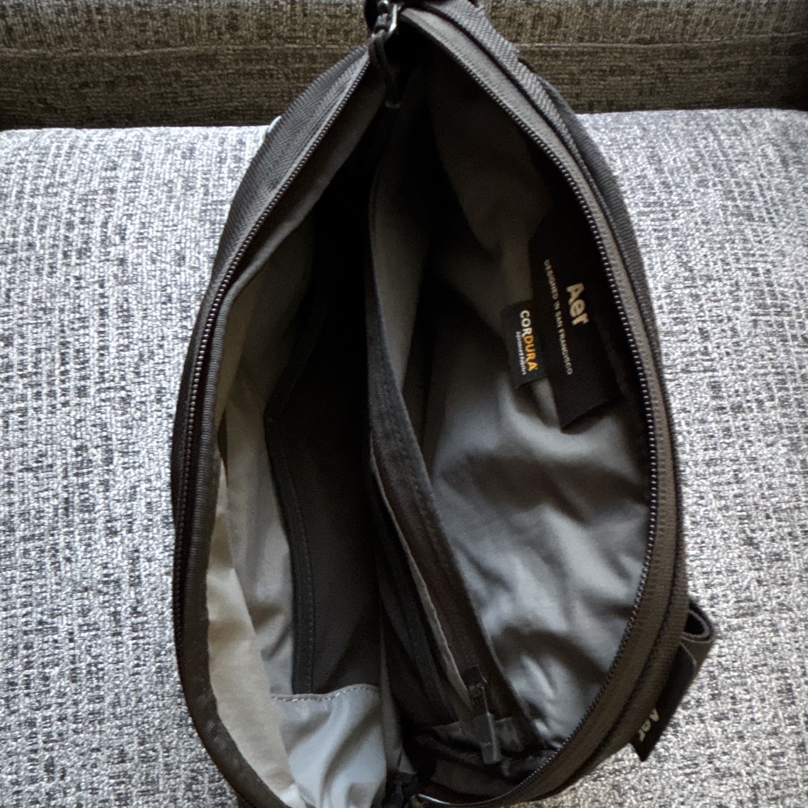 Aer Black Crossbody Sling Bag, Zip Closure, Adjustable Strap, Pockets