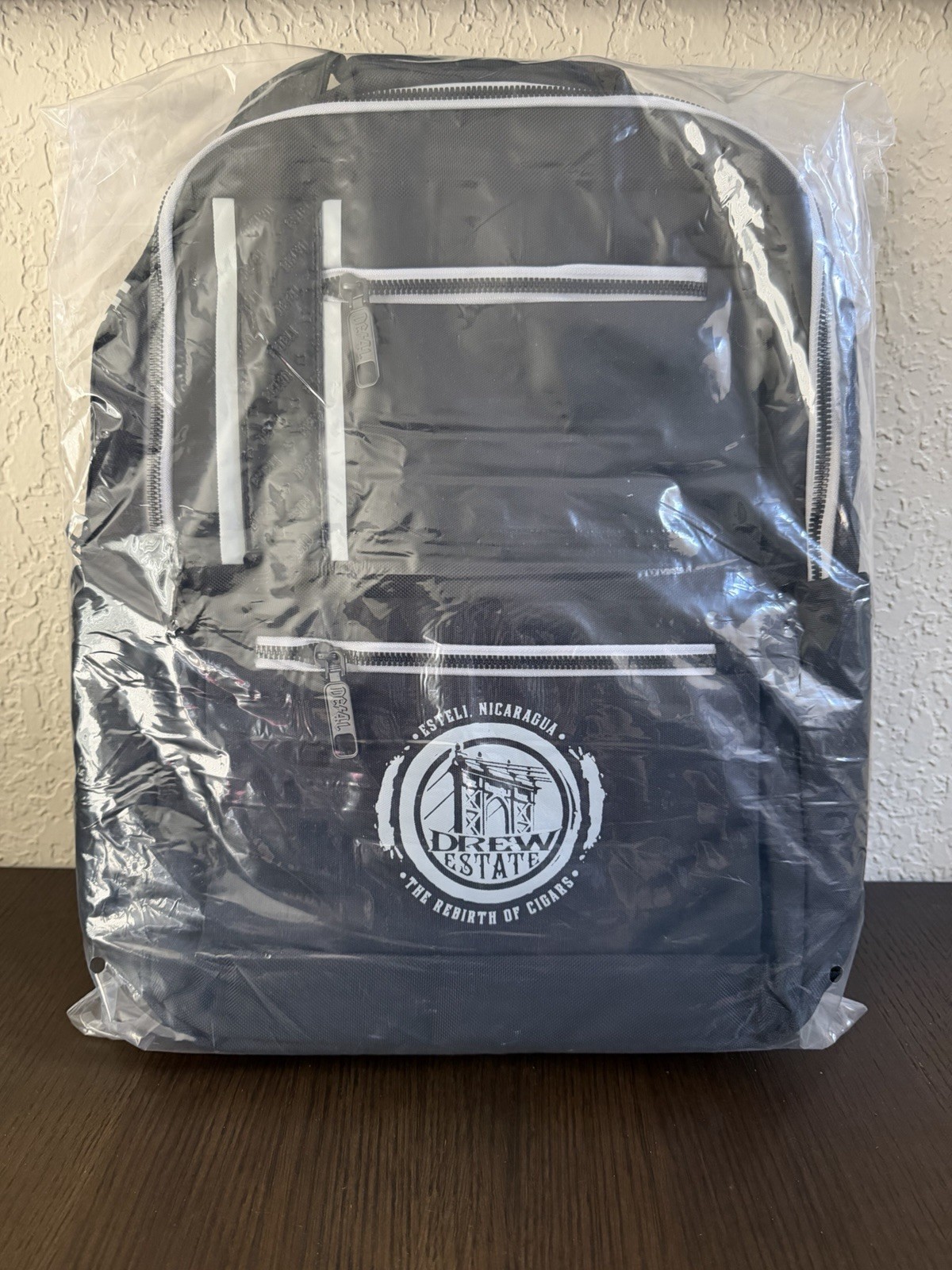 Drew Estate Black & White Backpack with Logo, Zip Closure, Padded, Outer Pockets