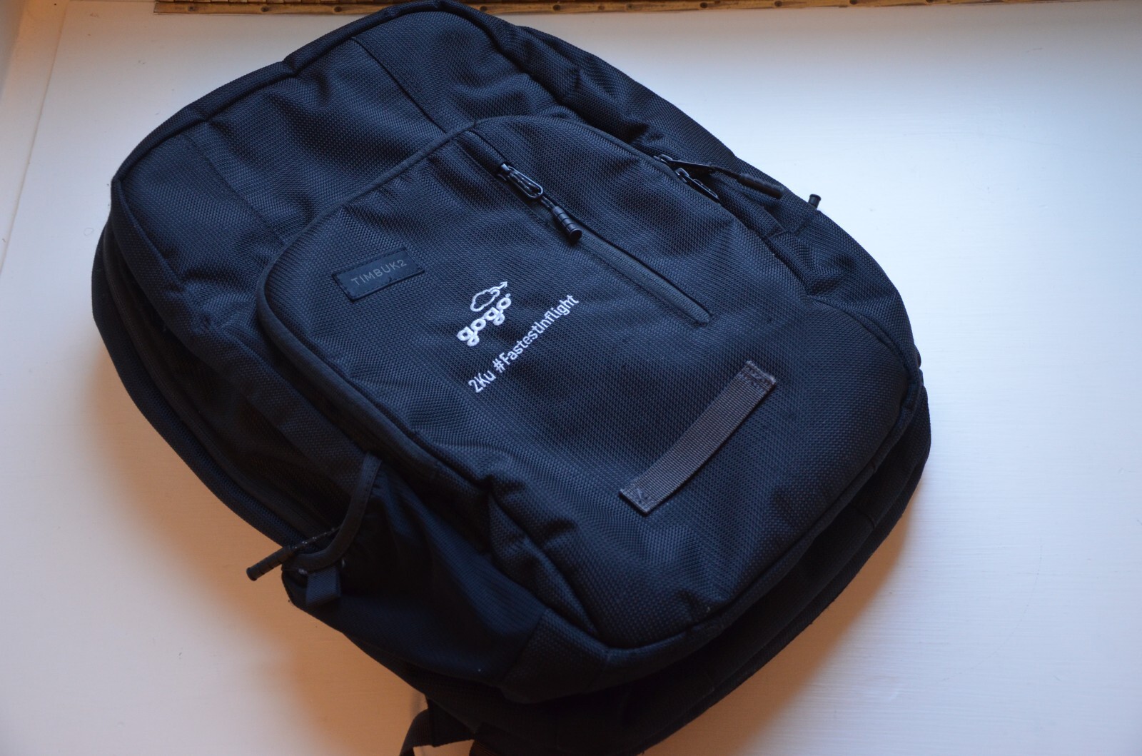 Timbuk2 One Love padded backpack, Gogo company logo, black EUC multiple pockets