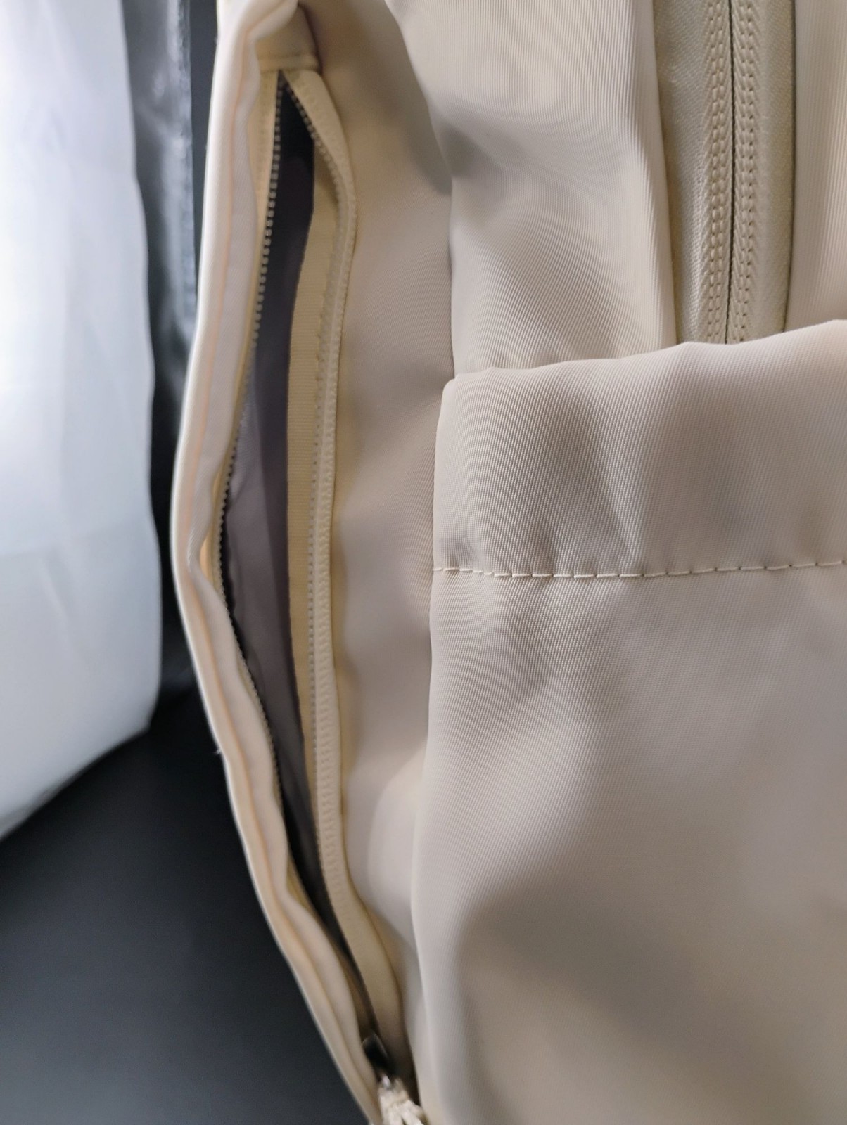 Minimalist Cream Backpack With Multiple Compartments & Padded Straps