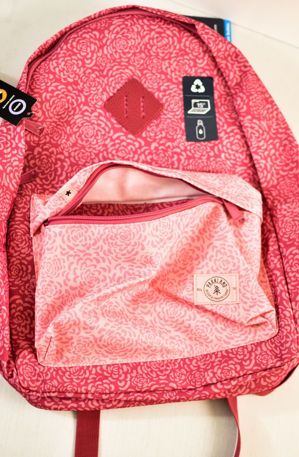 Palo backpack numerous pockets cushion straps laptop sleeve pink floral