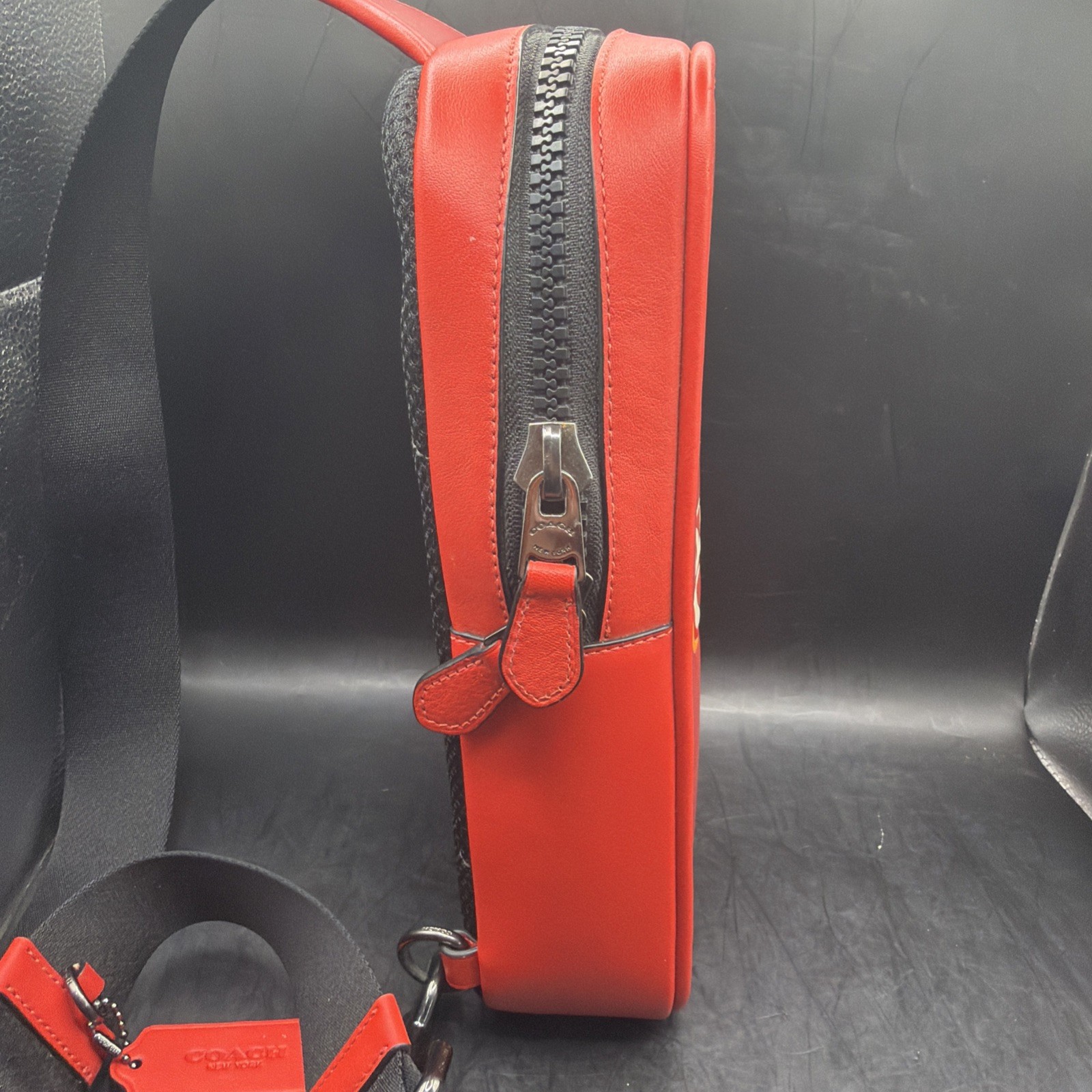 COACH Track Sling Backpack in Colorblock with Stamp in Red Ivory Orange