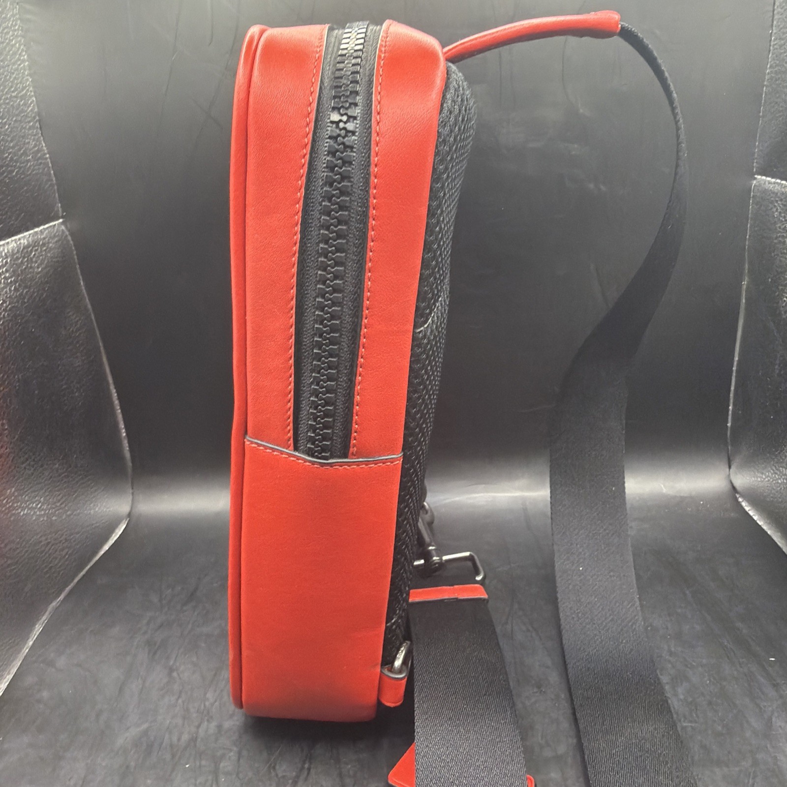COACH Track Sling Backpack in Colorblock with Stamp in Red Ivory Orange