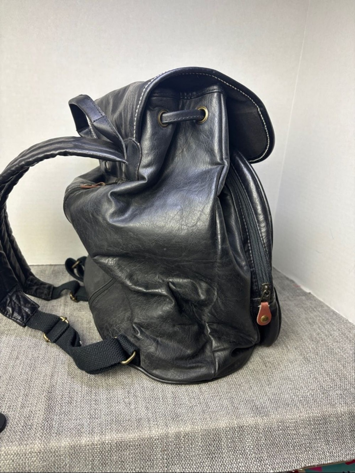 Tandem Black Leather Drawstring Backpack with Buckled Flap Cascade Falls