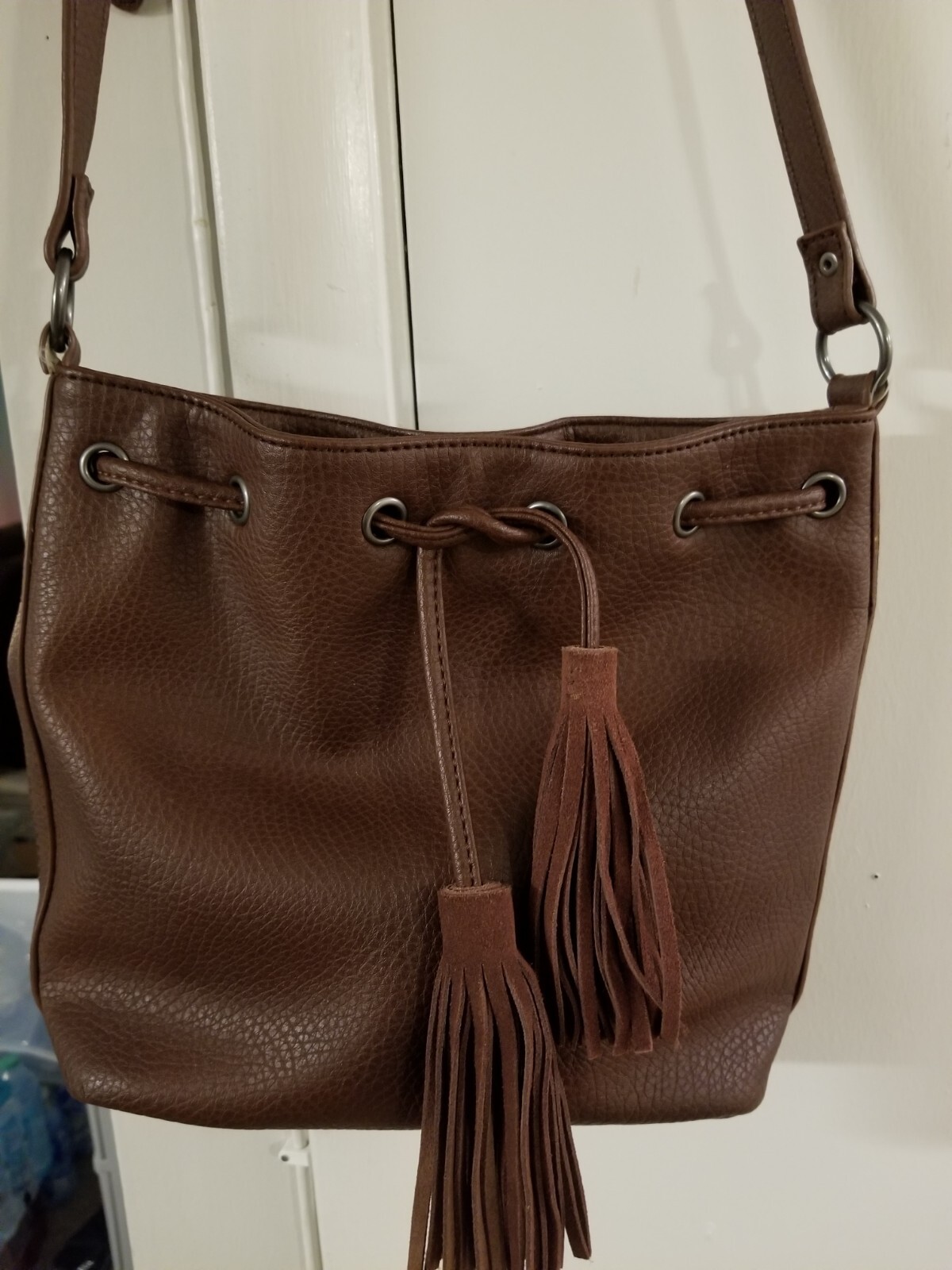 american eagle leather bucket bag With Wrap Around Leather Rope And Tassel