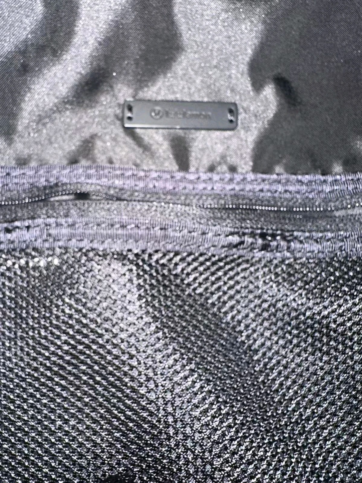 Black Lululemon City Adventurer backpack,iconic metal logo and waterproof fabric