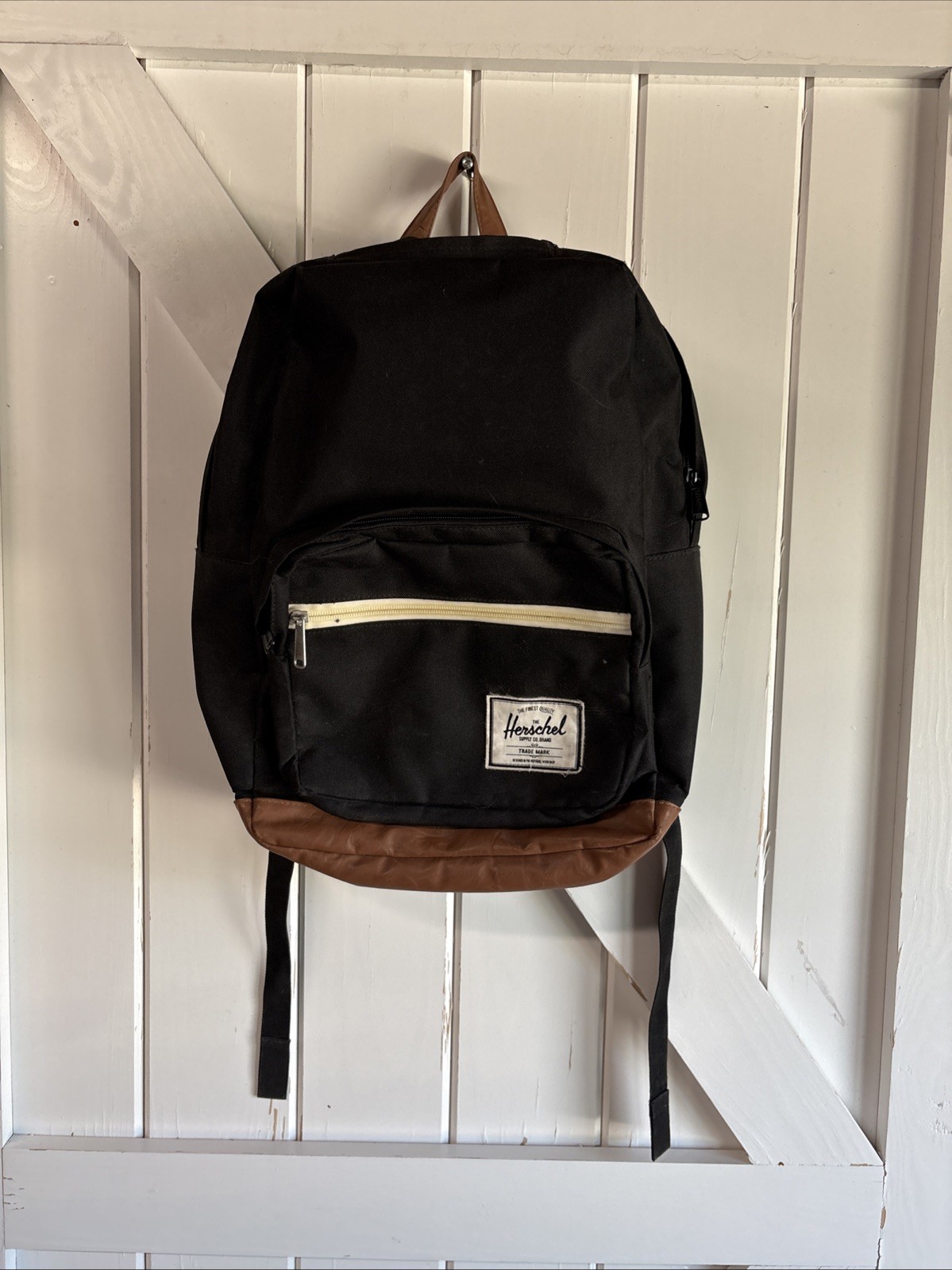 Herschel Supply Co. Pop Quiz backpack Black body with a brown synthetic leather