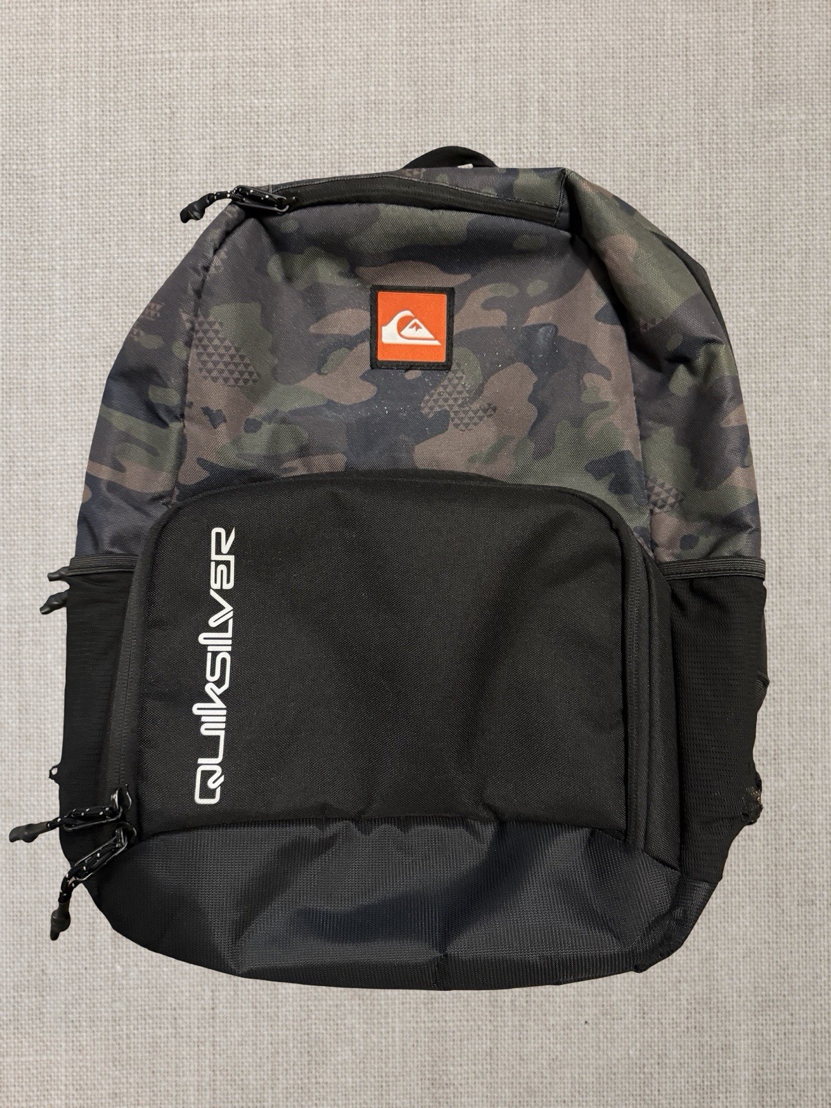 Quiksilver camo backpack with multiple compartments and zippers Back To School