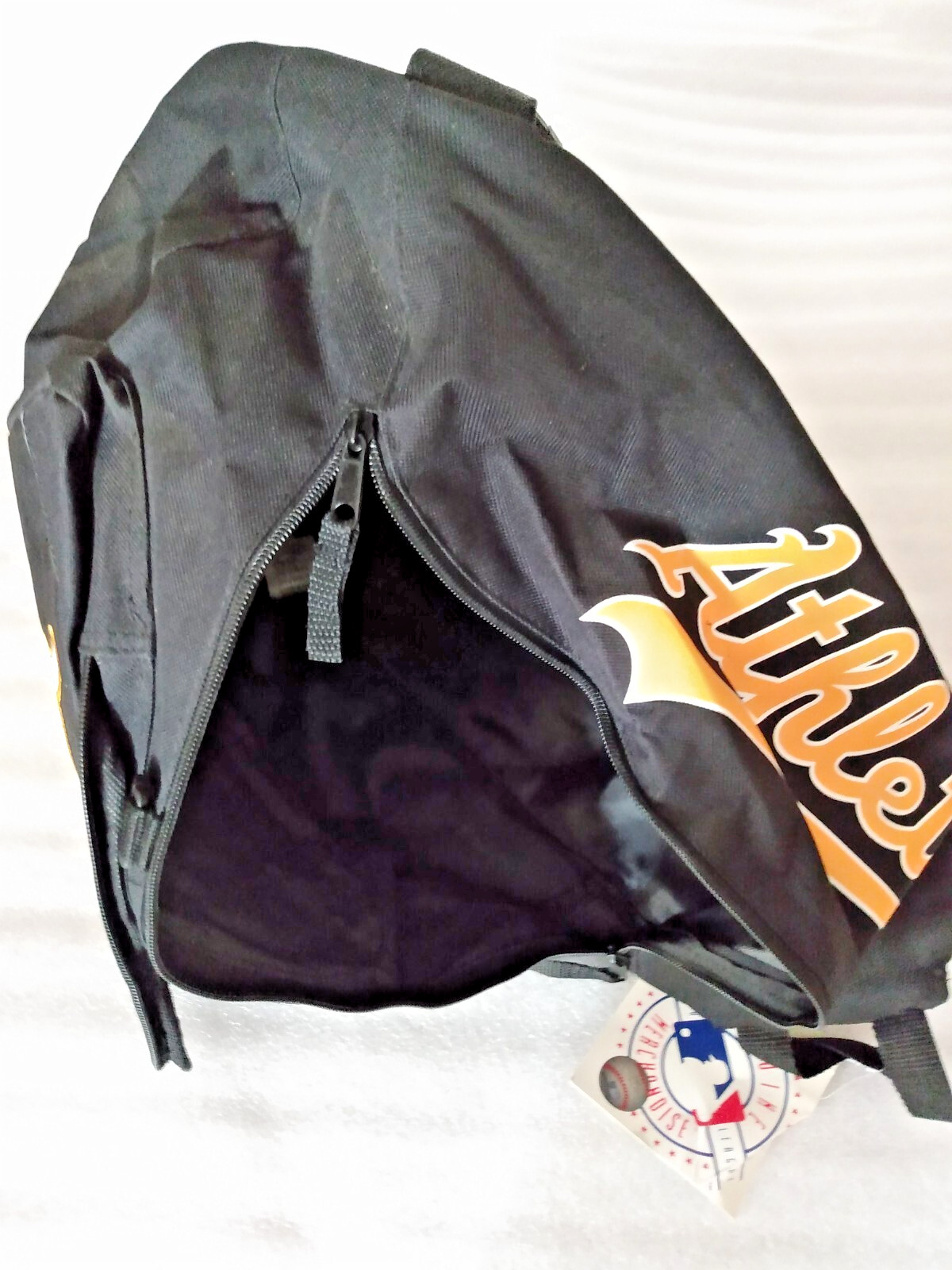 A’s baseball team black backpack 40L with white and gold lettering padded straps
