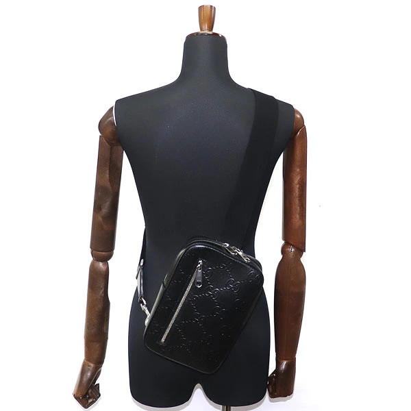 Gucci GG Embossed Sling Backpack Black Perforated Leather Crossbody Shoulder Bag