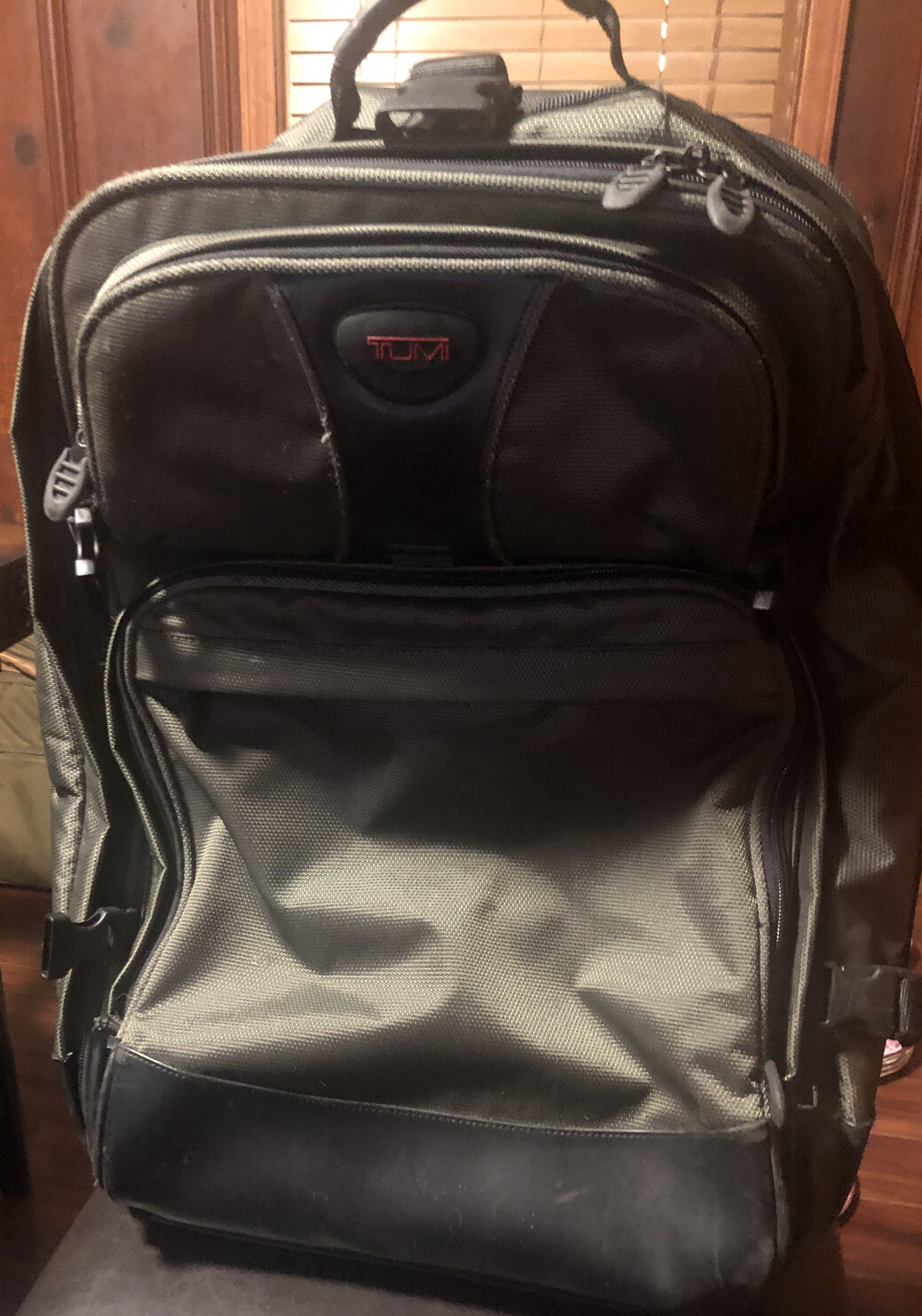 Used Tumi T2 Nylon Olive Green and Black Backpack Suitcase With Wheels.