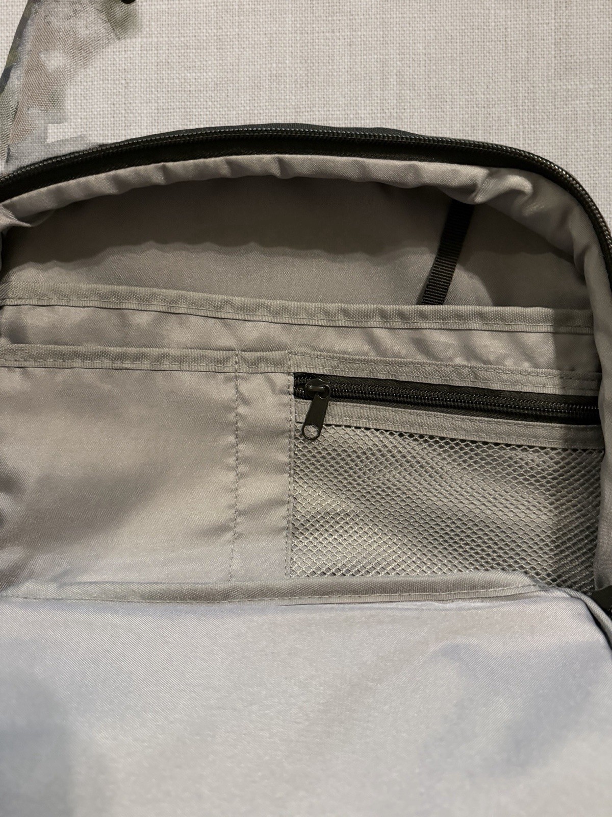 Quiksilver camo backpack with multiple compartments and zippers Back To School