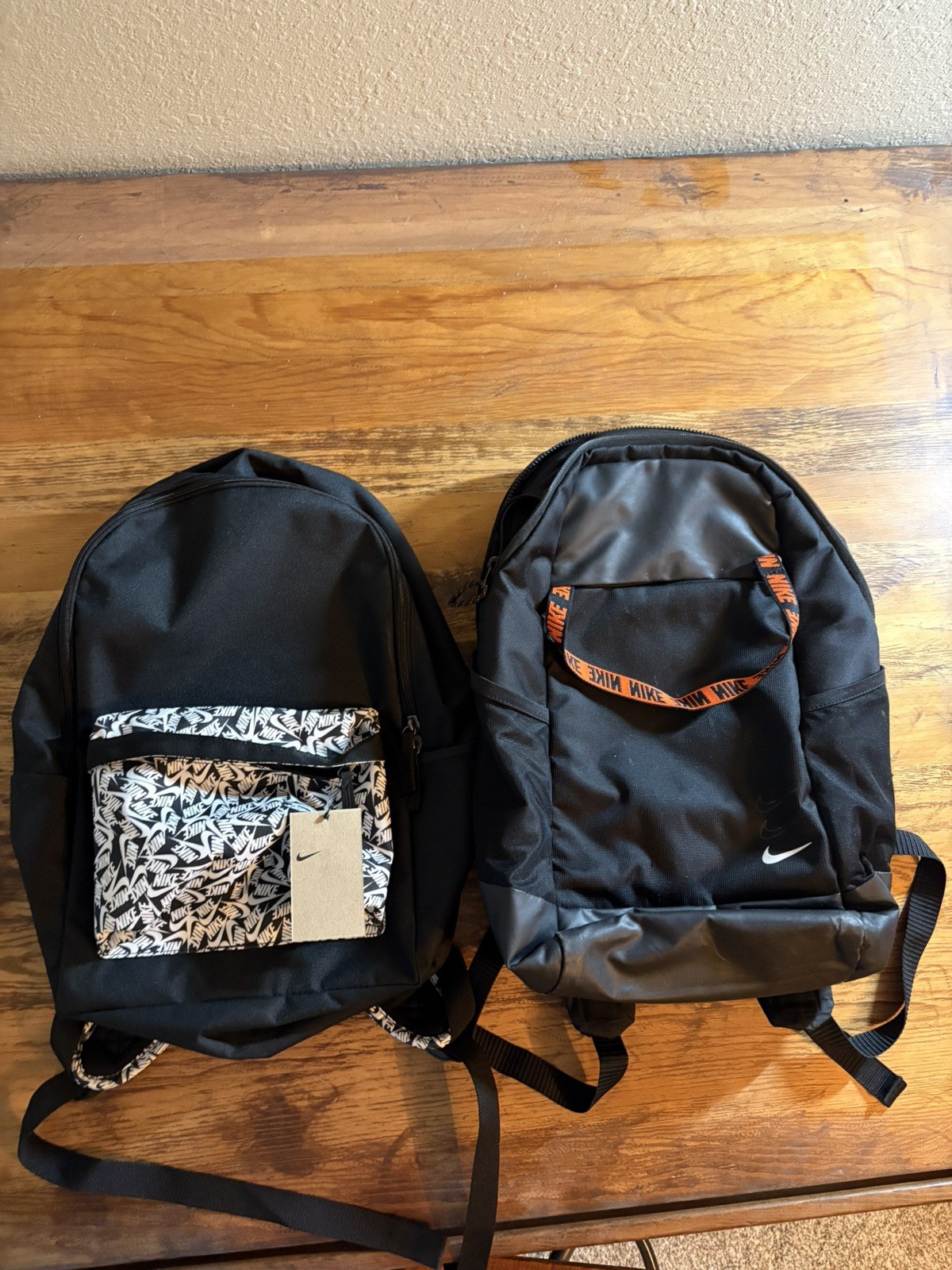 Two Nike Backpacks; One Brand New Heritage Backpack; One Slightly Used Backpack