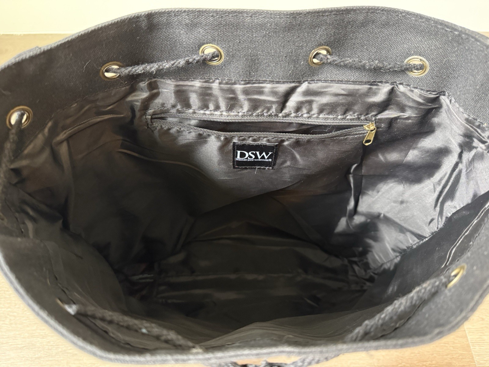 DSW Black Backpack Brown Trim Buckle/Drawstring, Adjustable, Pockets, Lined