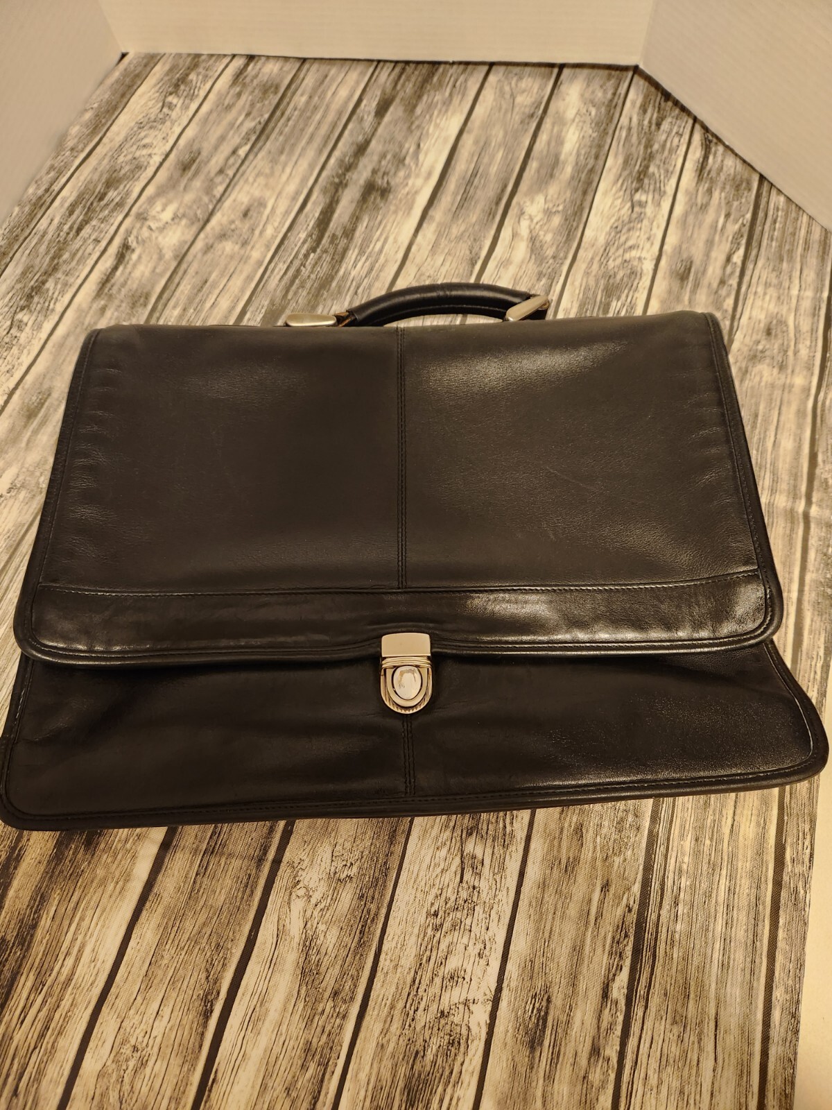 Black leather briefcase. Soft, Expands. W/ shoulder Strap
