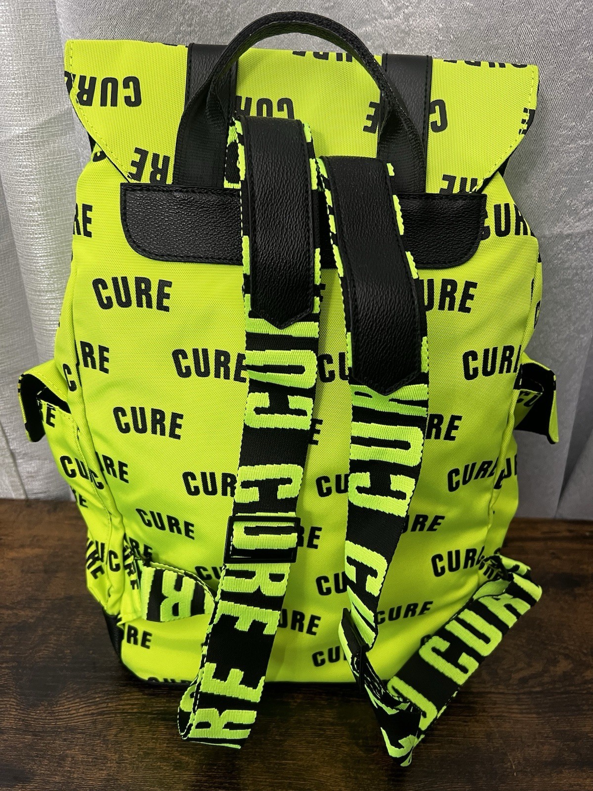 Green/Black CURE Logo Print Backpack Drawstring Buckle Adjustable Straps