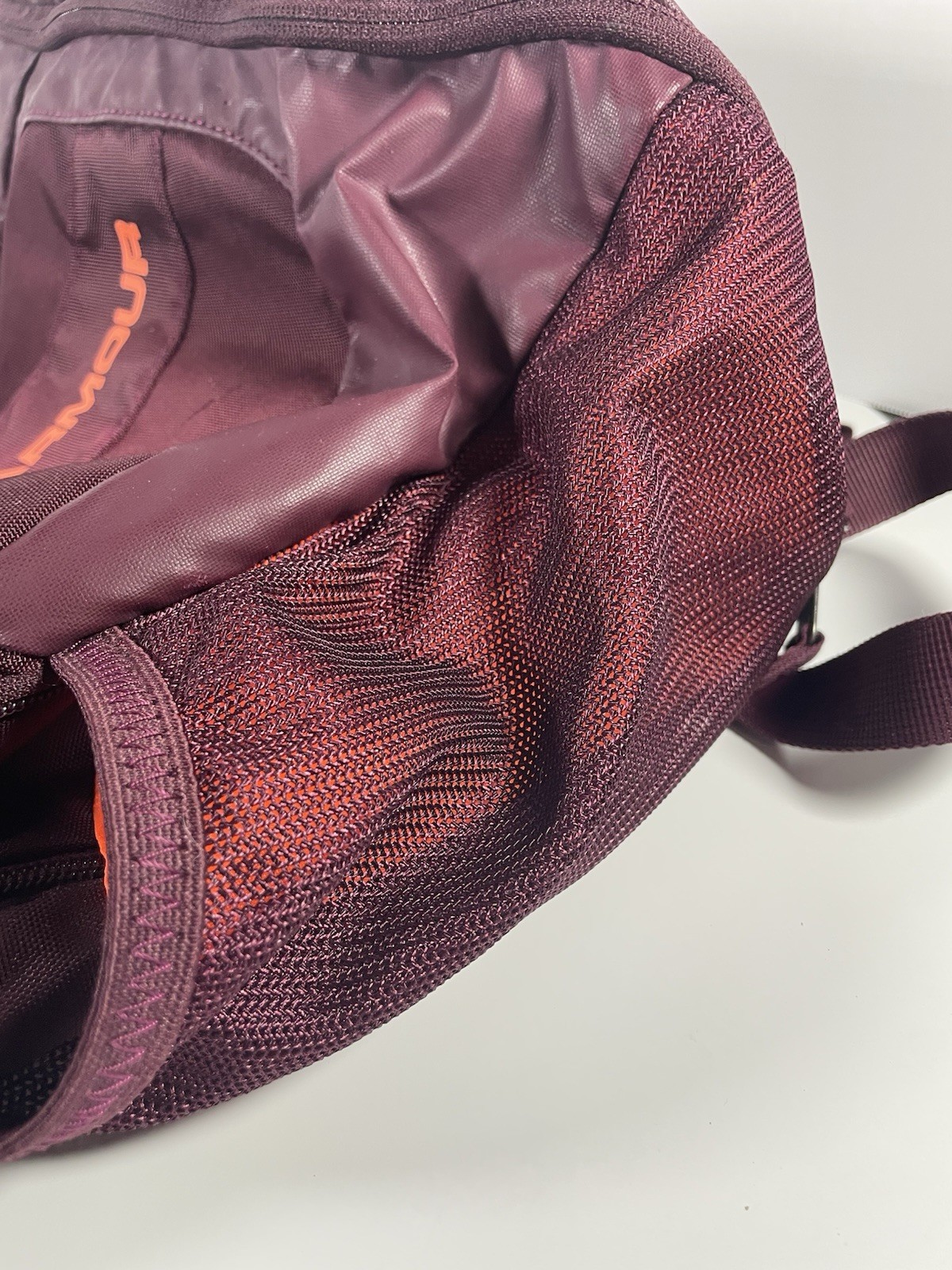 Under Armour Hustle 3.0 Backpack in the Dark Maroon and Orange colorway.