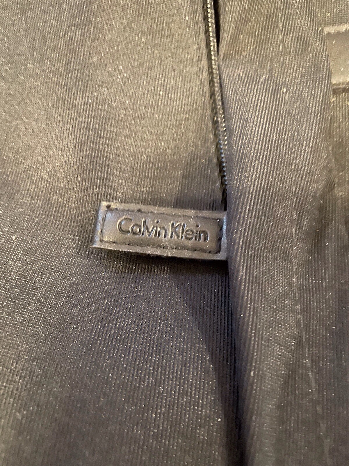 Calvin Klein 100% Polyester travel duffle bag black, shoulder strap, And Handles