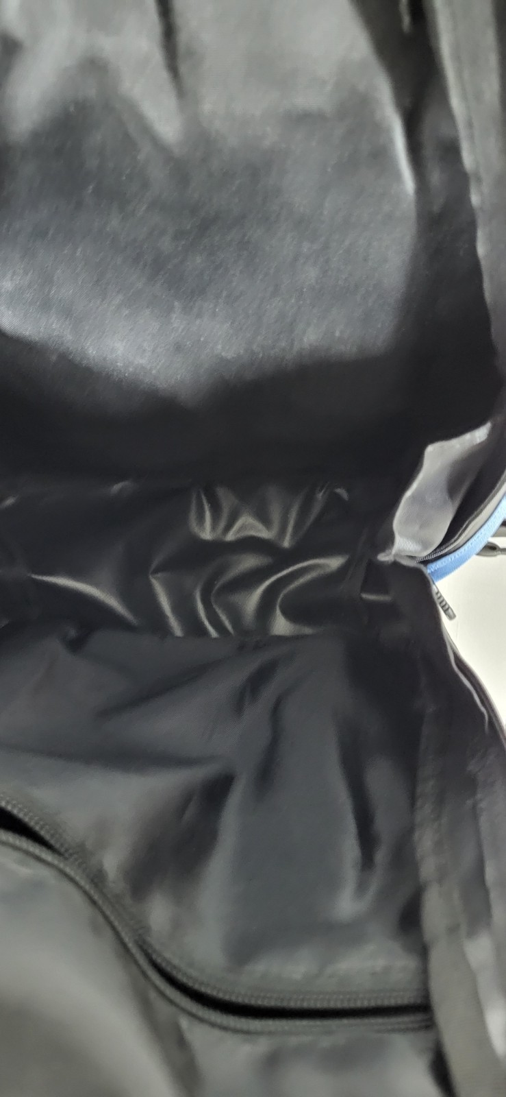 black and blue Reebok backpack