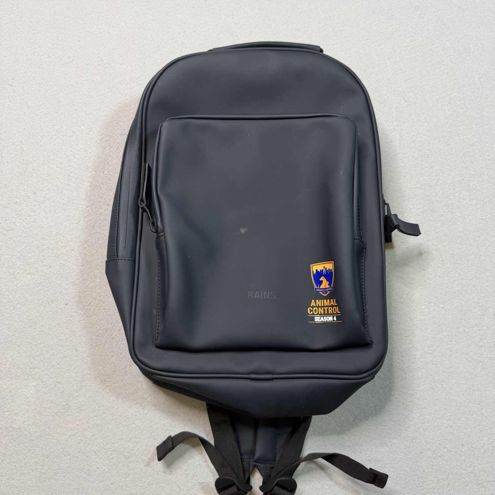 Rains Travel Matte Black Backpack Animal Control Season 4 Fox