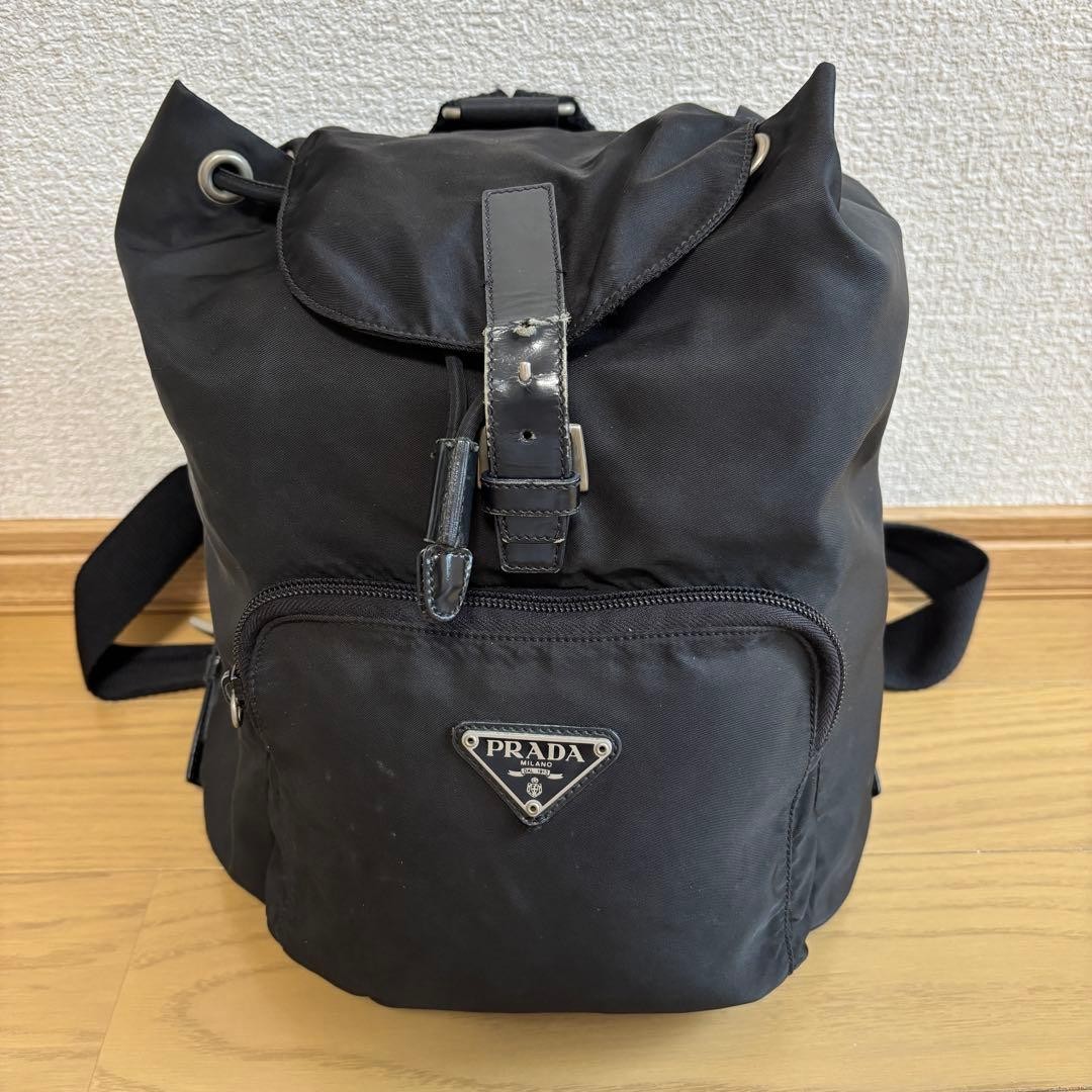 Prada Rucks Saffiano Triangular Plate