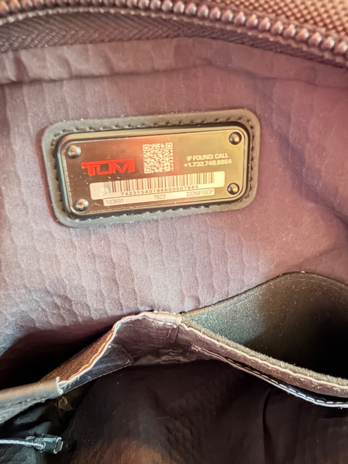 tumi backpack gray and black – has a couple of marks shown in pictures