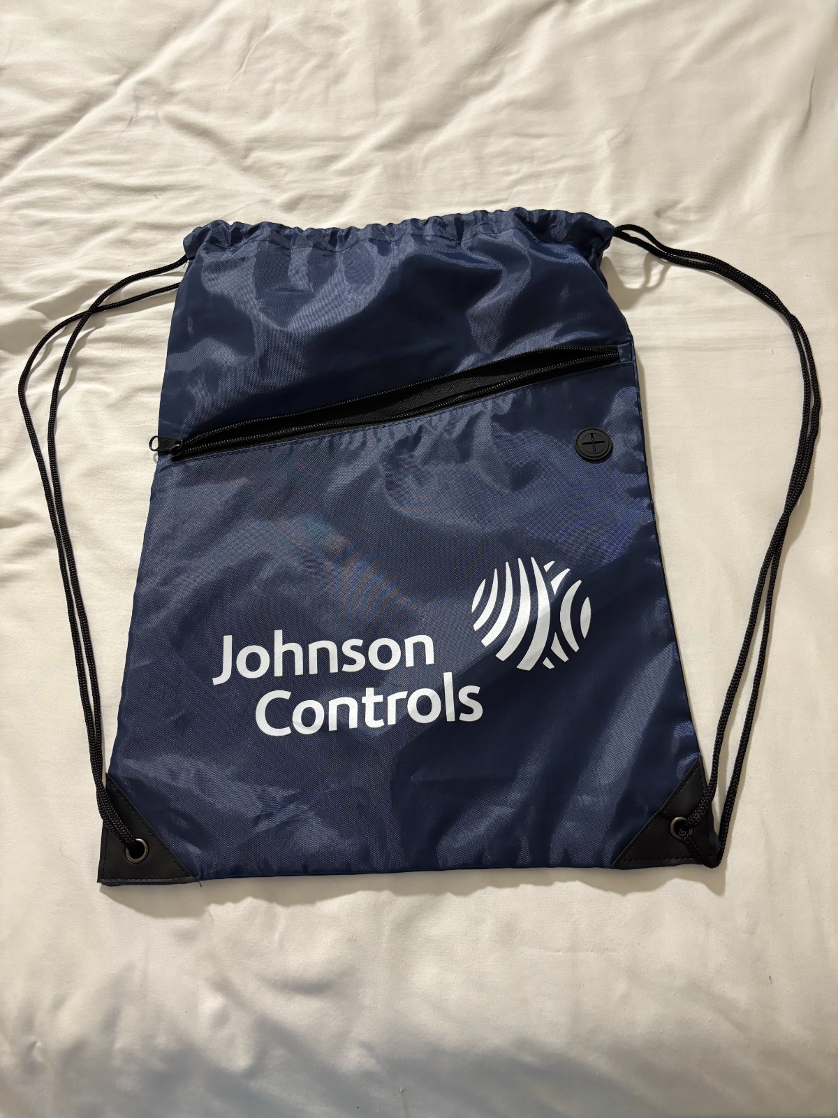 Johnson Controls draw string bag with zipper front pocket – navy blue