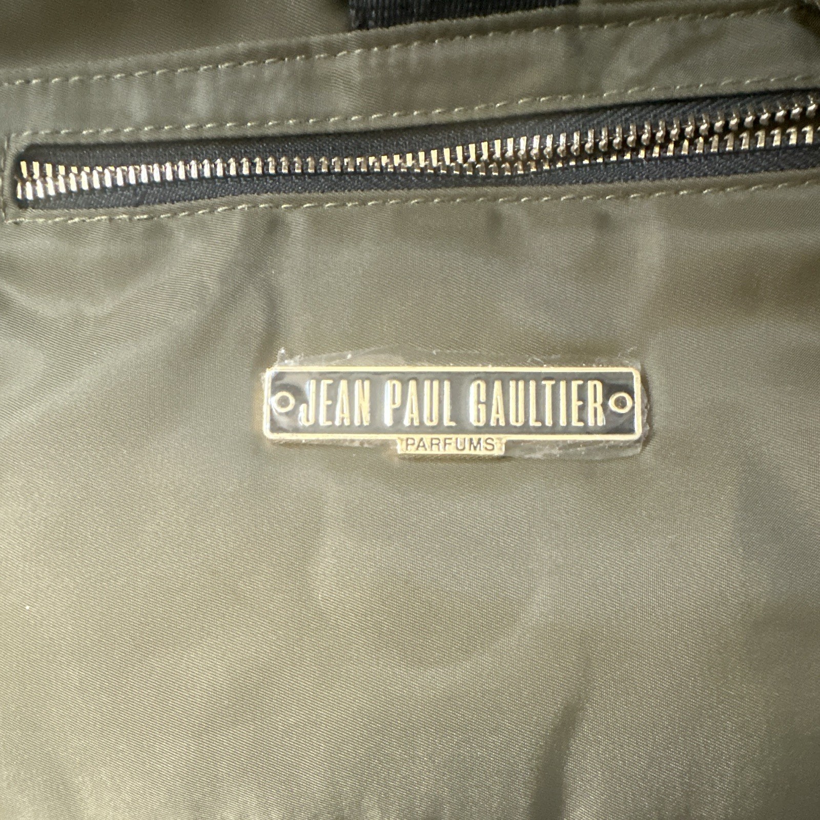 Jean Paul Gaultier Parfums Green Backpack Orange Lining Zip Buckle Pockets