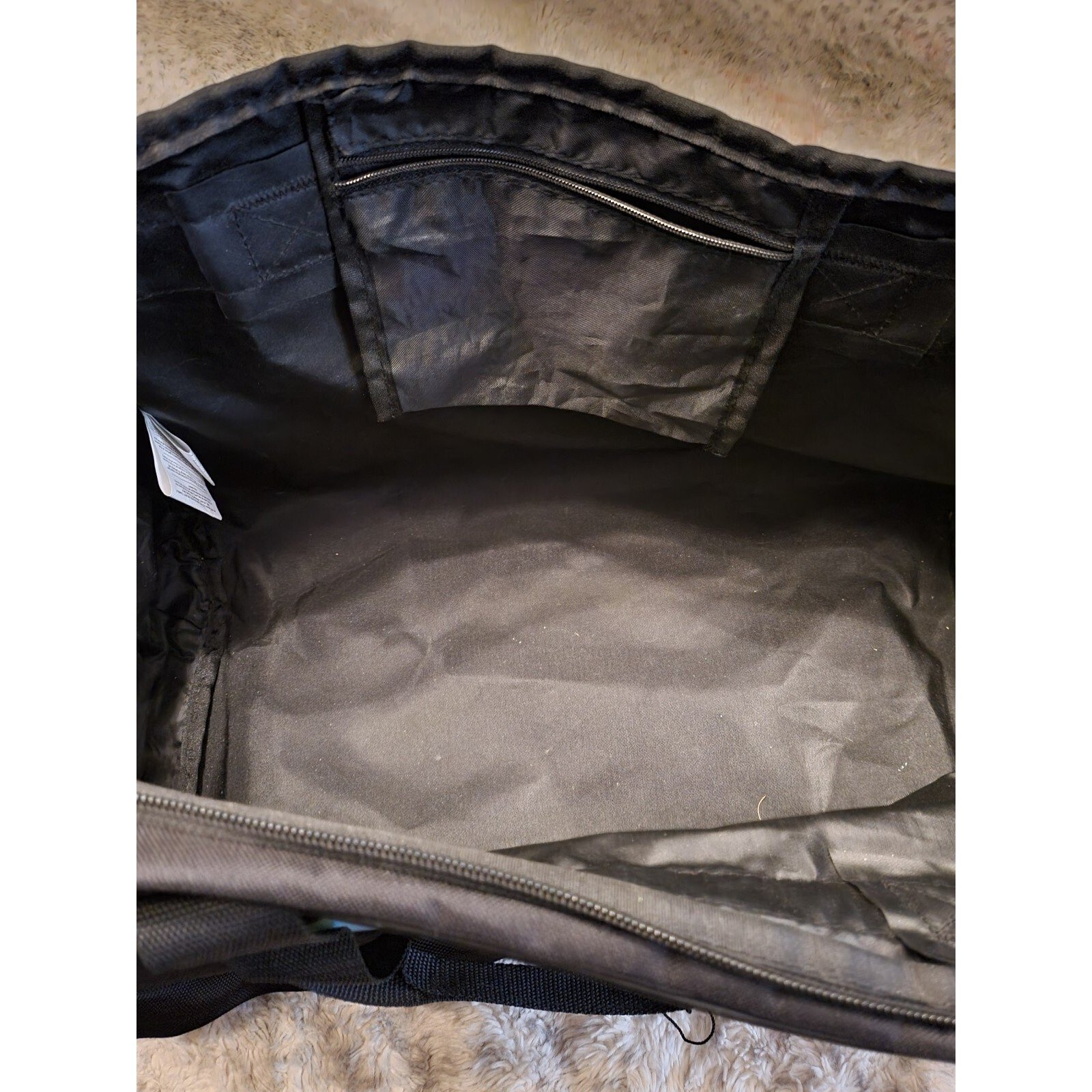 Puma Black Evercat Dispatch Duffel Bag. Dimensions: 17.3 x 12.6 x 1.5 inches