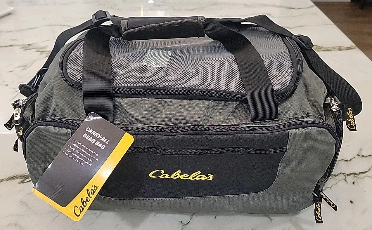 Cabela’s travel bag (6028). Zipper Closure. New. Gray Color. For Man Or Women.